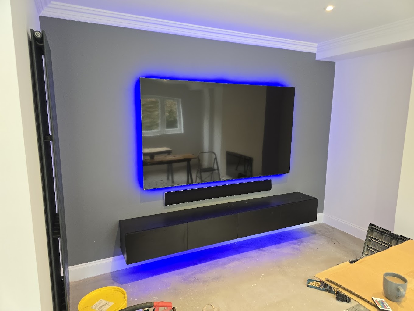 Wall-mounted TV with backlight